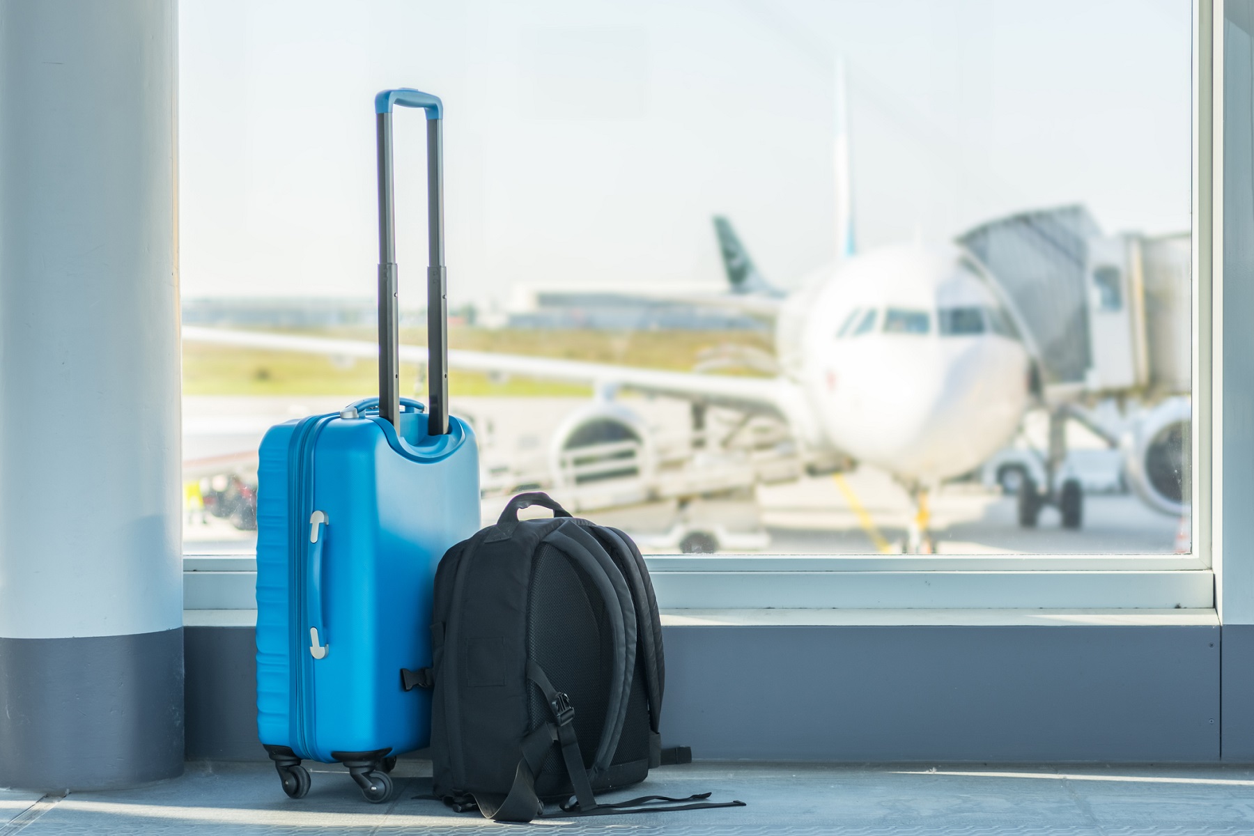 Carry-on in front of a plane