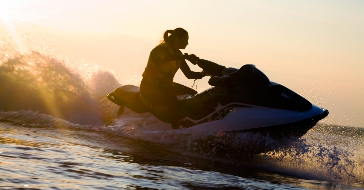 woman on jet ski at dusk