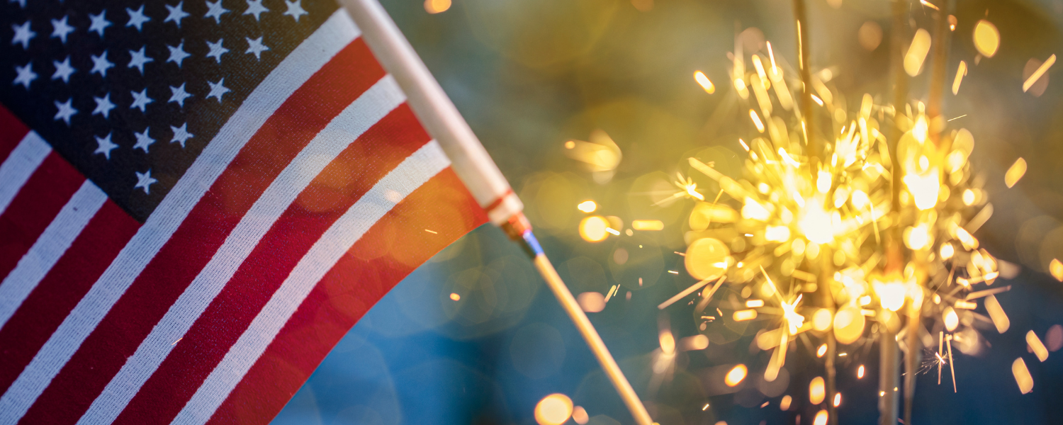 closeup of a US flag and sparkler