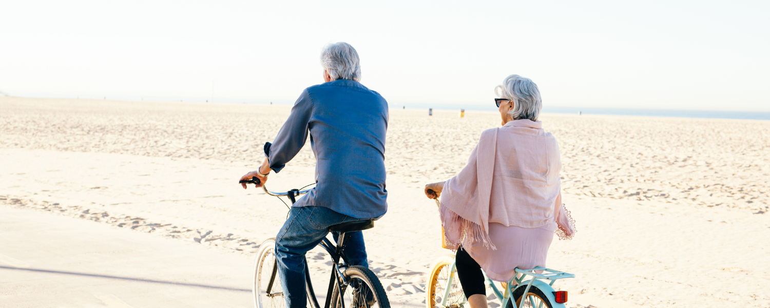 couple biking on the beach