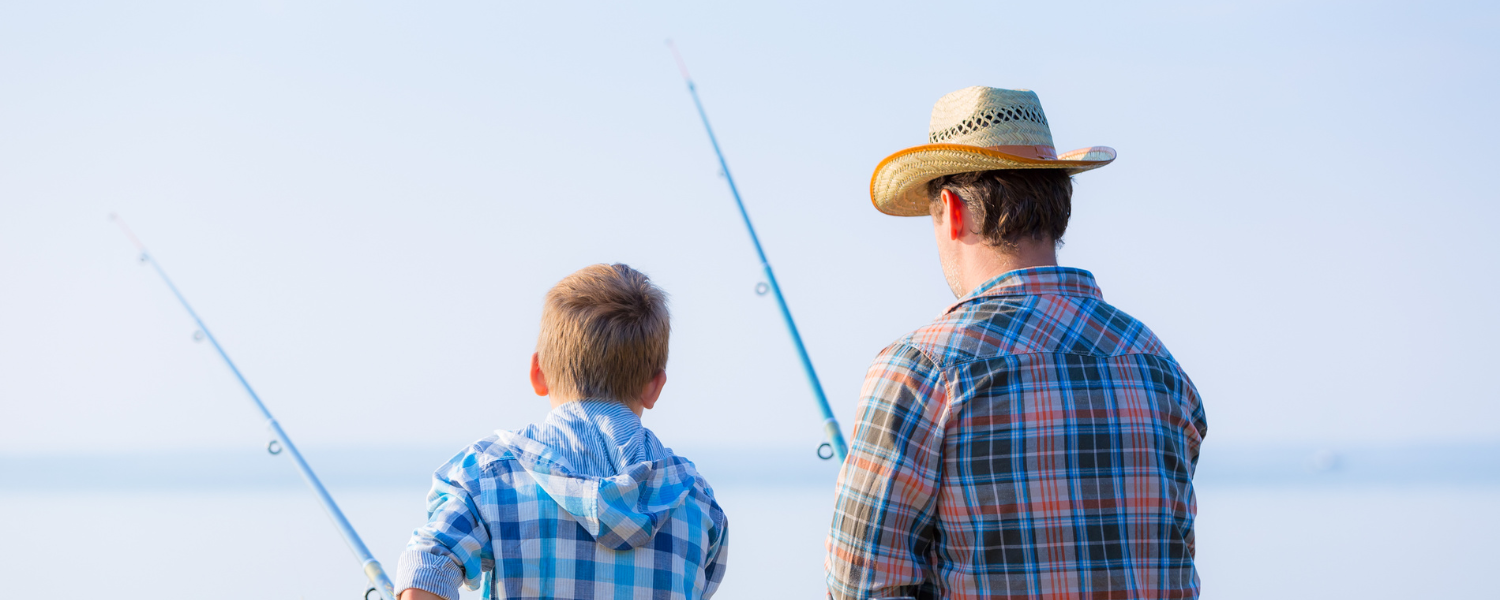 man in hat and boy fishing