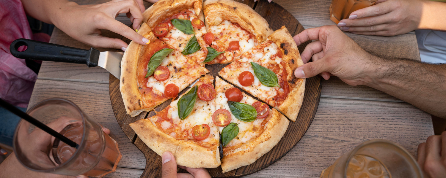 people sharing a pizza