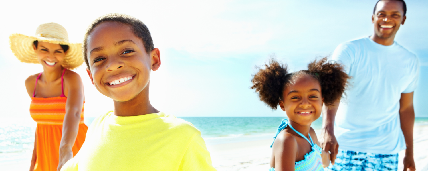 African American family walking on beach